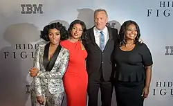 Cast members (from left to right) Janelle Monae, Taraji P. Henson, Kevin Constner and Octavia Spencer at a screening of Hidden Figures. The backdrop reads 'Hidden Figures' and 'IBM'.