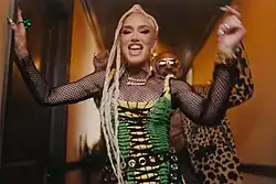 A color picture of singer Gwen Stefani, in the music video for the song "Light My Fire".