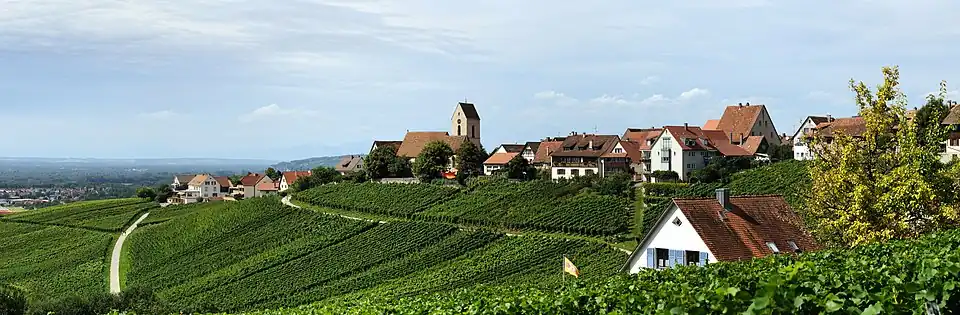 Panoramic view of Ötlingen from the southeast; the hilly landscape is typical for the region of Markgräflerland