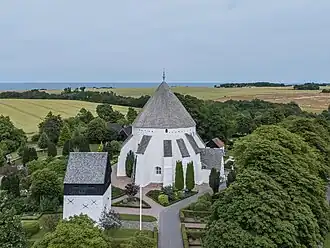 Aerial view of the freestanding tower and the church