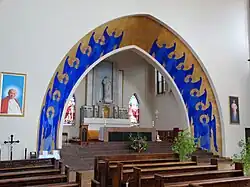 Altar and chancel separated by an arch
