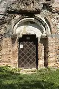 Romanesque portal of rotunda with exterior fresco