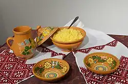 A decorated bowl of yellow porridge