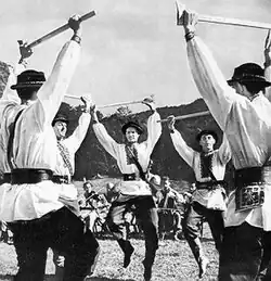 A group of men dancing in a circle