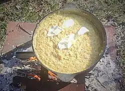 A pot of porridge over a fire