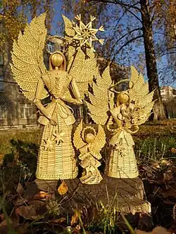 Three angel figurines made of straw