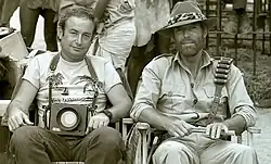 Chamberlain and photographer Yoni S. Hamenachem on the set of King Solomon's Mines in Zimbabwe