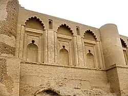 Decorative niches with polylobed arches at Qasr al-'Ashiq in Samarra, Iraq (9th century)