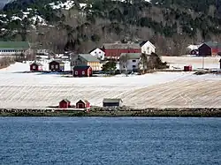 Coastal farm area along the fjord.