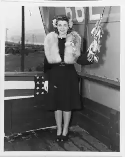 Miss Louise Leahy poses with the christening bottle