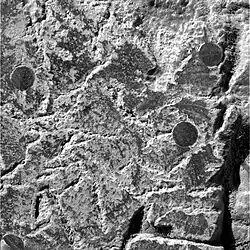 Figure 15. Close-up of sediment matrix and embedded hematite spherules abraded by Opportunitys Rock Abrasion Tool. This Eagle Crater image covers an approximate 32 mm x 32 mm area. It was taken on Sol 34 (2004-02-29).