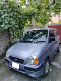 A blue 2004 Hyundai Santro in Pakistan