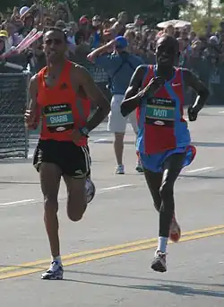 Patrick Ivuti and Jaouad Gharib running side by side towards the camera