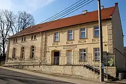 Community center and grocery store in Morów