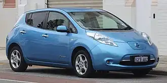 A light blue Nissan Leaf hatchback