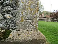Benchmark at the base of the bell tower