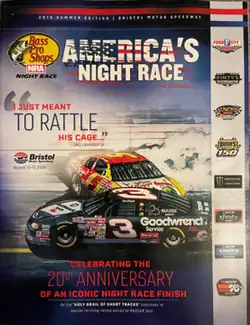 The 2019 Bass Pro Shops NRA Night Race program cover, featuring the finish of the 1999 Goody's Headache Powder 500 between Dale Earnhardt and Terry Labonte.