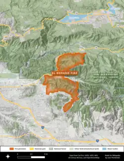 The footprint of the El Dorado Fire is shown in orange, extending from Highway 38 in the north to between Oak Glen and Cherry Valley in the south in an irregular shape against the San Bernardino National Forest in dark green.