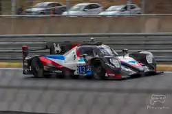 A grey, red and blue racing car