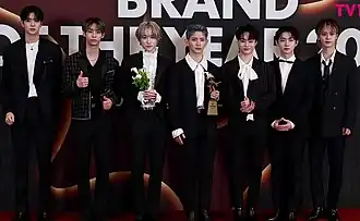 Tempest receiving their award trophy at the 2023 Brand of the Year Awards.