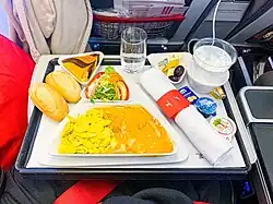 Airline premium economy in-flight meal. Viennese sweet pepper chicken with spaetzle.