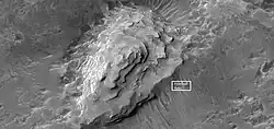 Close view of layered mound in Crommelin crater, as seen by HiRISE. Box indicates the size of a football field for scale.