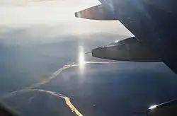A vertically stretched subsun, seen from an airplane