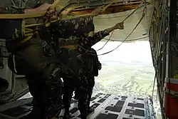 Airmen of the 710th Special Operations Wing prepare to jump from a KC-130 during Parachute Operations training.