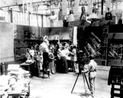 Image 37A.E. Smith filming The Bargain Fiend in the Vitagraph Studios in 1907. Arc floodlights hang overhead. (from History of film)