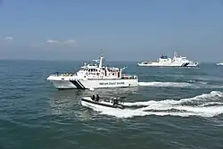 An ABG-class fast interceptor with the OPV ICGS Varaha during a rescue exercise