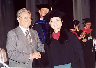 Financer and philanthropist George Soros congratulates a new graduate at the Commencement ceremony of 2003
