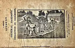 Woodcut etching of lanky Andrew Jackson wearing a Napoleon hat and using a stick to beat a crouching slave, half a dozen other slaves, both children and adults, are chained together behind them, and being led out of frame, a slave cabin stands beside a hill in the background