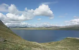 A large lake surrounded by hills