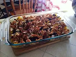 An ad hoc American casserole with ground beef, onions, peppers, mushrooms, herbs, spices, and bread