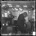 Adolf Henrik Lindstrøm in the kitchen at Framheim, Amundsen's base in Antarctica during the expedition to the South Pole, 1910–1913.