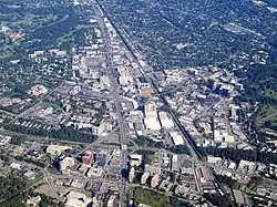 Aerial view of dense urban development surrounded by suburban development