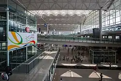 The main concourse of a wide, modern airport