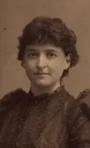 Portrait photograph of Agnes Inglis, wearing a black dress