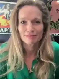 Photo of Alexis Bloom wearing a green shirt