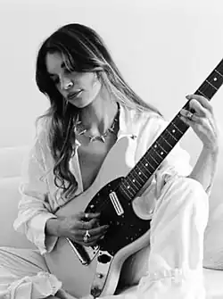 A gold gramophone trophy with a plaque set on a table