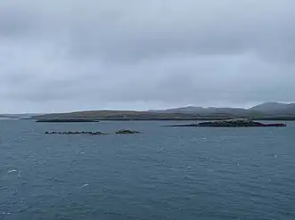 Flodday from the south with the hills east of Loch Portain, North Uist beyond