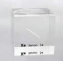 A partly filled ampoule containing a colorless liquid