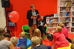 The author reading his book to a young audience