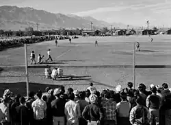 Image 38Japanese-Americans spectating a World War II-era game while in an internment camp. America's ties to immigrants and to Japan have been deeply shaped by a shared baseball heritage. (from History of baseball)