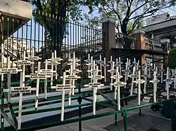 49 crosses with the names of the children killed during the fire.