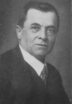 Keramopoulos in early middle age, in a formal suit, with short, dark hair