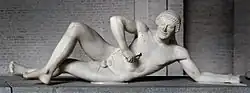 Attributed by some to Onatas or his school: Fallen Trojan warrior, figure W-VII of the west pediment of the Temple of Aphaia, Glyptothek, Munich, c. 505–500 BC