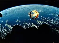 Exhaust flame may not be visible outside the atmosphere, as in this photo. Rocket engines are the dark structures at the bottom center.