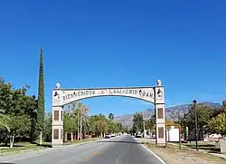 Lamadrid’s arch-shaped welcome sign