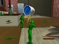 Green soldiers surround a tan soldier on a wooden desk consisting of paper, a coffee table book, and cups (the one in the center having a blue vortex). This is all in a room with a pink-and-white wall.